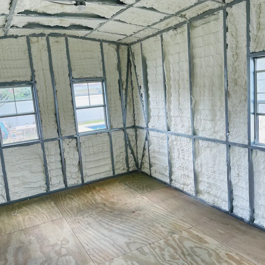 Closed-cell spray foam insulation applied to wall cavities in a residential project in Carroll